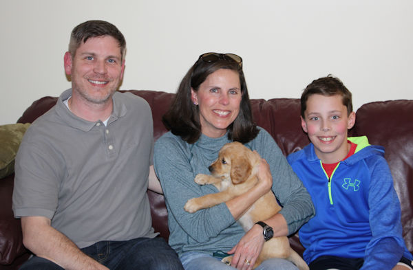 Family and puppy going home