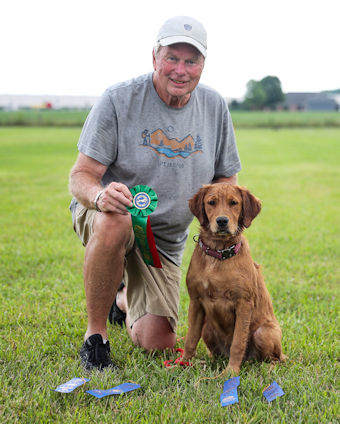 Puppy & owner with ribbons