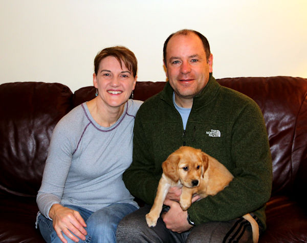 Family and puppy going home